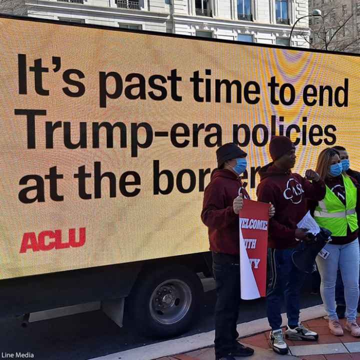 Billboard saying "It's past time to end the Trump-era policies at the border"